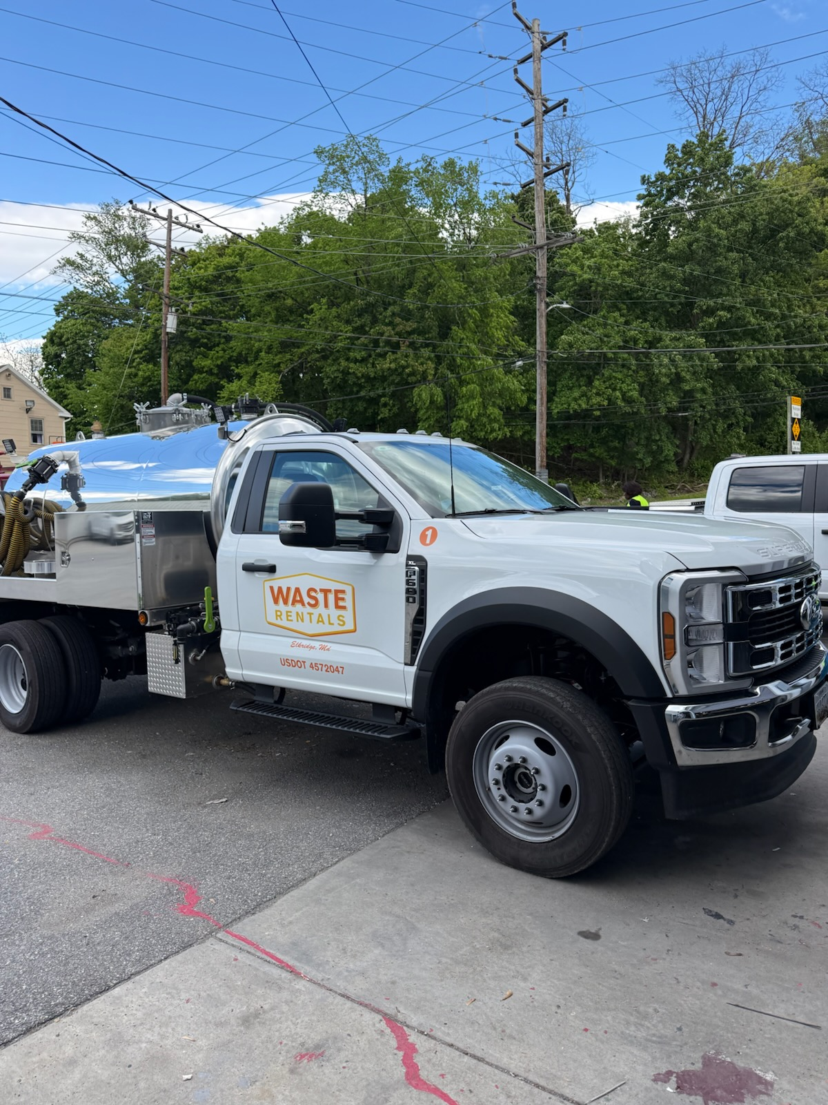 Waste Rentals service truck delivering portable restrooms in Maryland