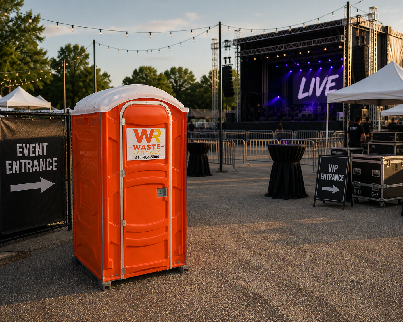 Waste Rentals portable restroom near a prepared outdoor event venue